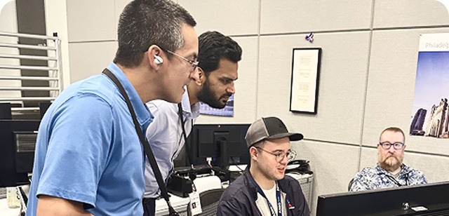 Crew members and IOC staff testing the ECS design together at a workstation